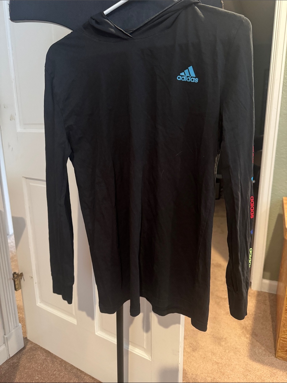 adidas lightweightBlack Hoodie with Blue Chest Logo and Multicolor Sleeve Accent